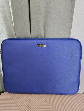kate spade cobalt blue laptop sleeve with gold logo plaque